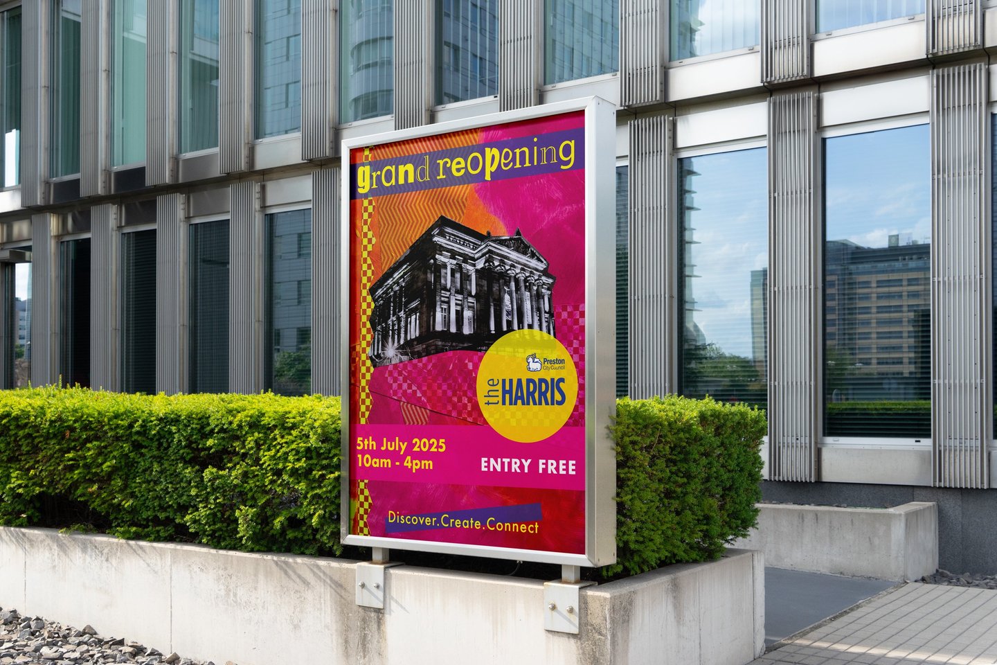 Large format poster on street displaying Harris Museum grand reopening event details