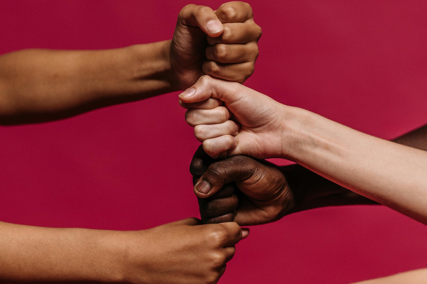 a group of people holding hands together suggesting trust and safety