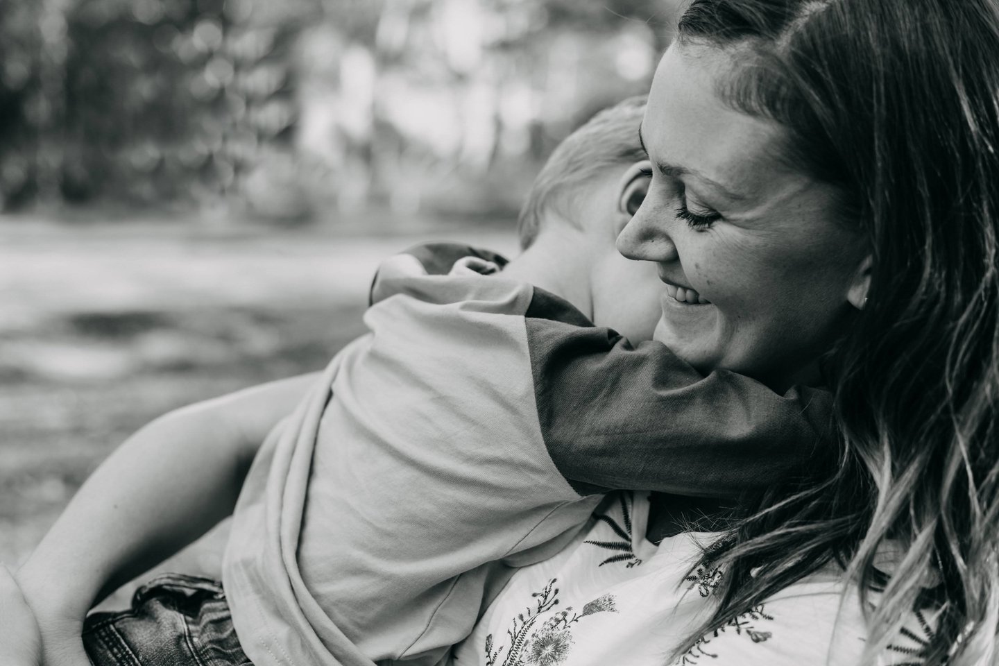 a woman holding a child in her arms