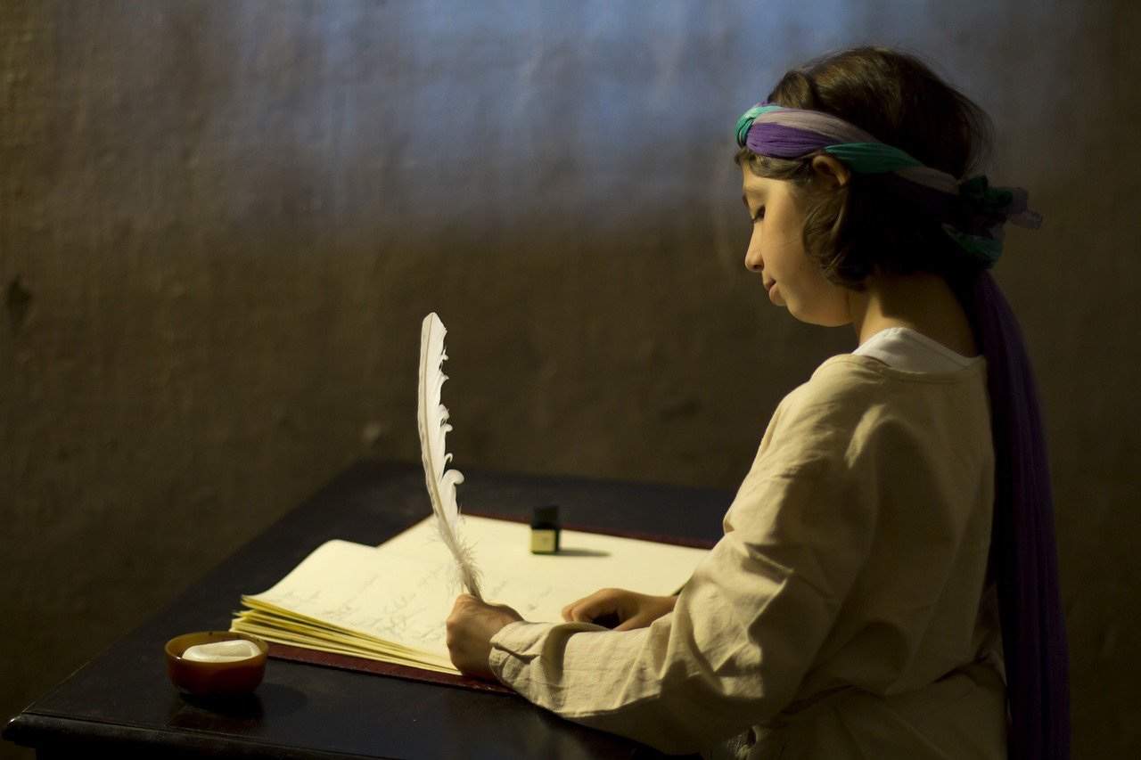 Here we go again. My Feature Articles are coming back. Image: a girl writes with a feather.