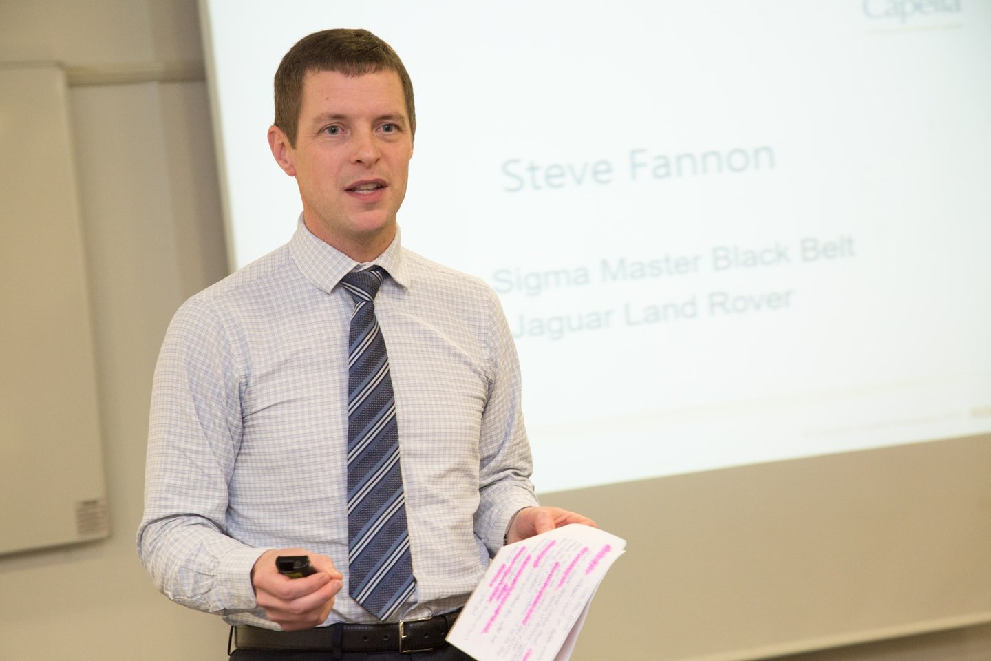 Steve Fannon presenting to a dinner audience in a previous role and organisation.
