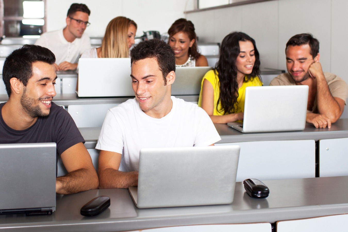 a group of people sitting at desks in a classroom-Ai-Integrated Digital Academy