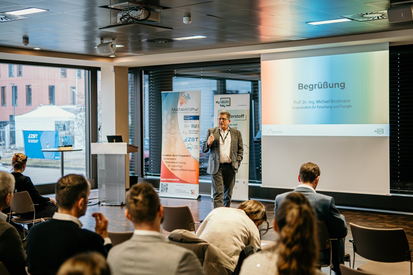Professor Michael Brodmann giving a keynote presentation at a hydrogen technology research seminar.