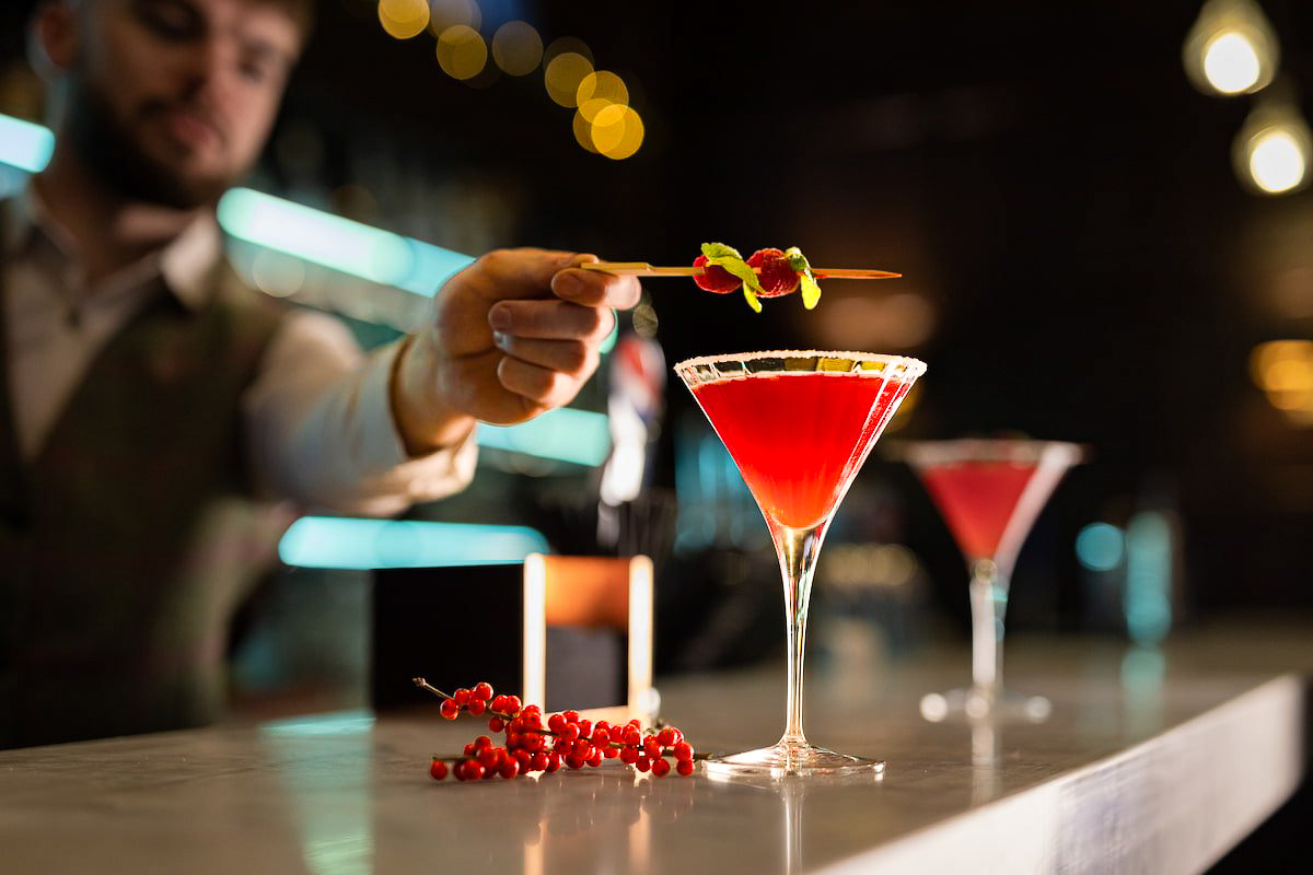 man making cocktail in a bar
