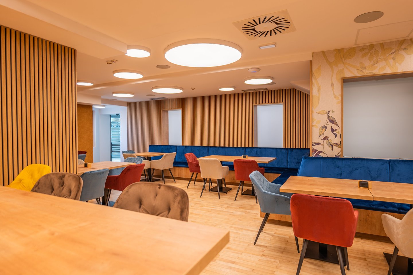 a restaurant with a wooden table and chairs