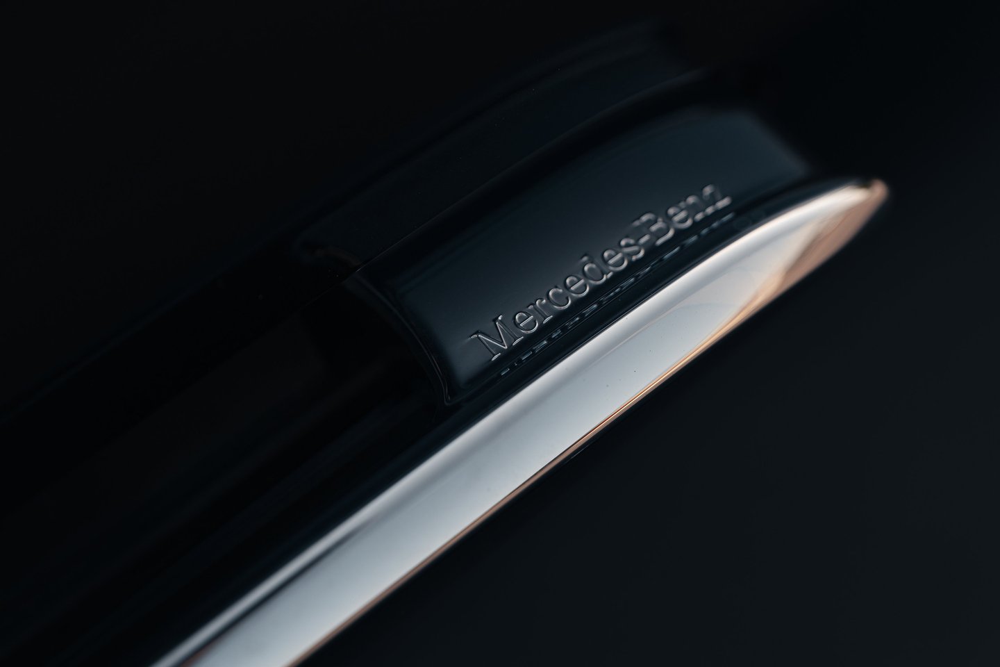a close up of a mercedes benz door handle