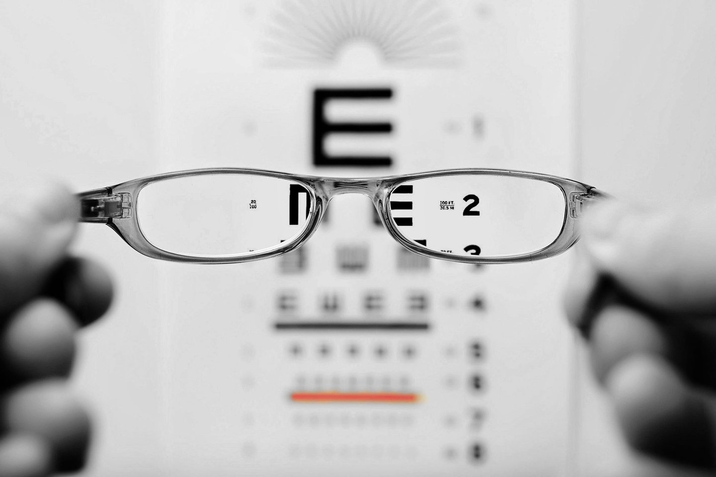 a pair of glasses showing focused and clear letters