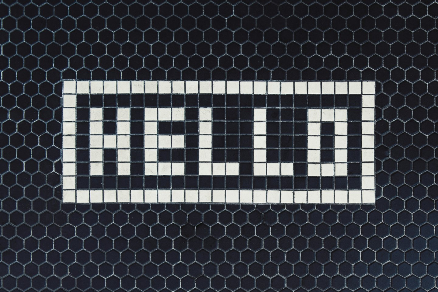 a black and white tile with a white and black checkered pattern