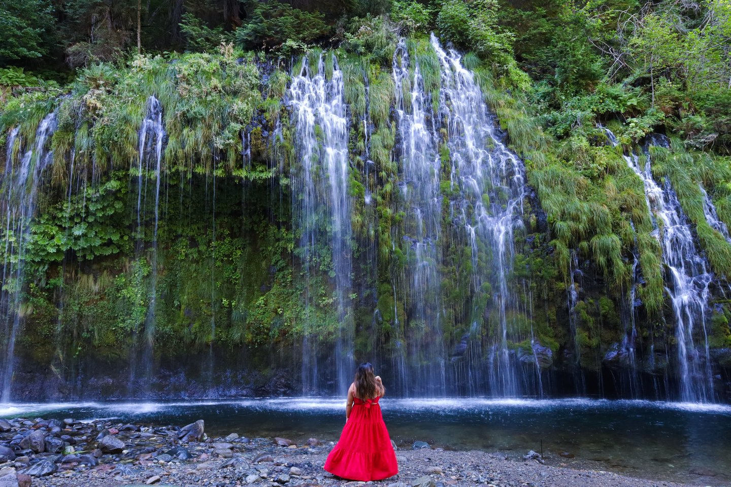 california, waterfalls, mossbrae falls, a woman in a red dress standing in front of a waterfall
