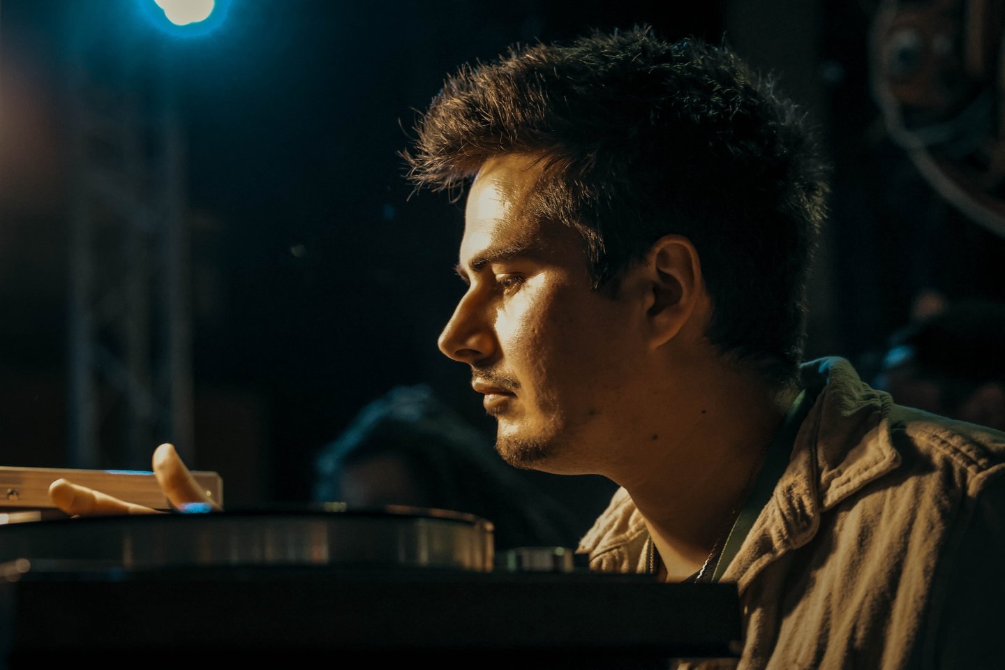 a man sitting at a table with a laptop