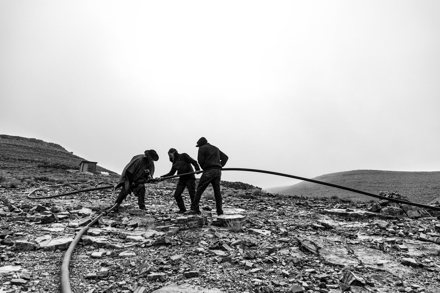 a group of men working on a mountain