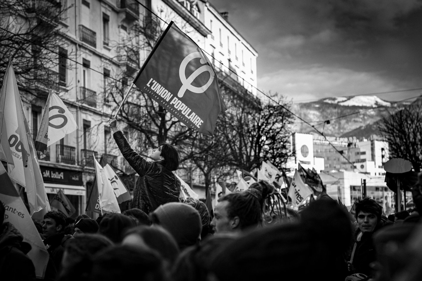 a women holding a banner in a strike