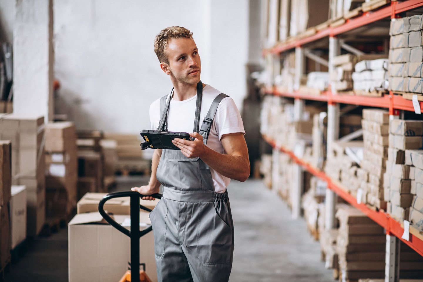 a man standing in a warehouse