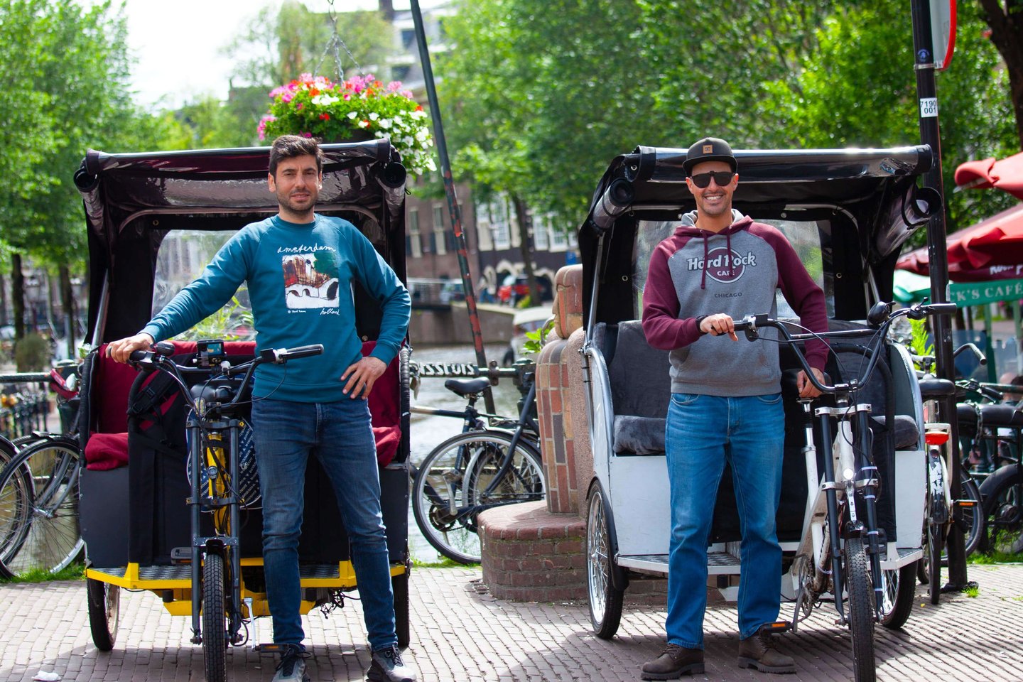 italian guys next to their bike taxis