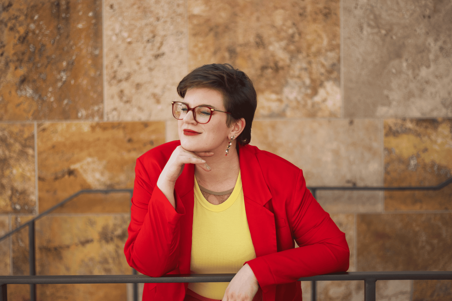 Swana Schuchmann in a red jacket and glasses