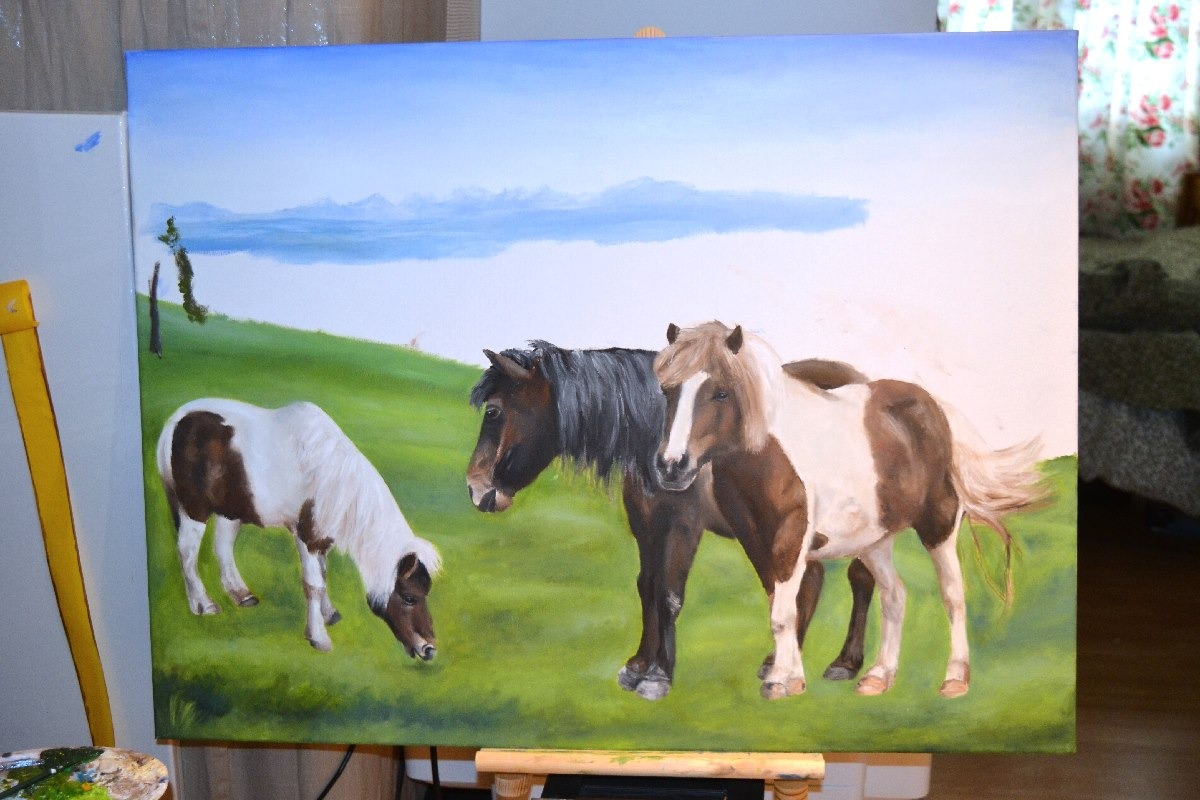 an unfinished painting of horses in a field