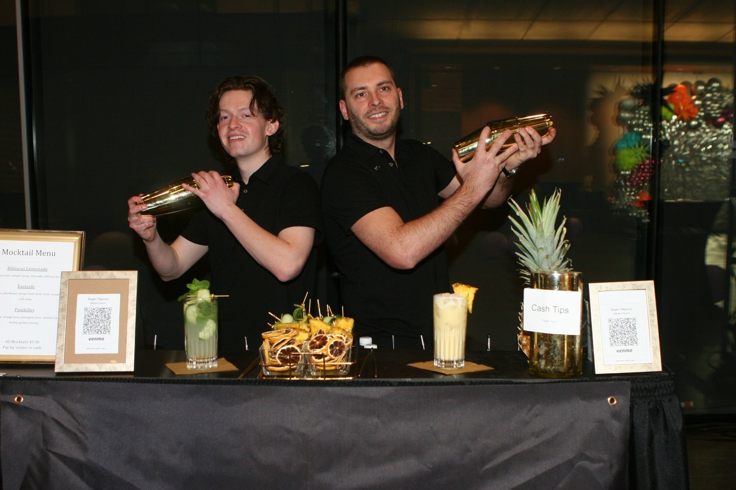 bartenders shaking cocktails for a corporate party