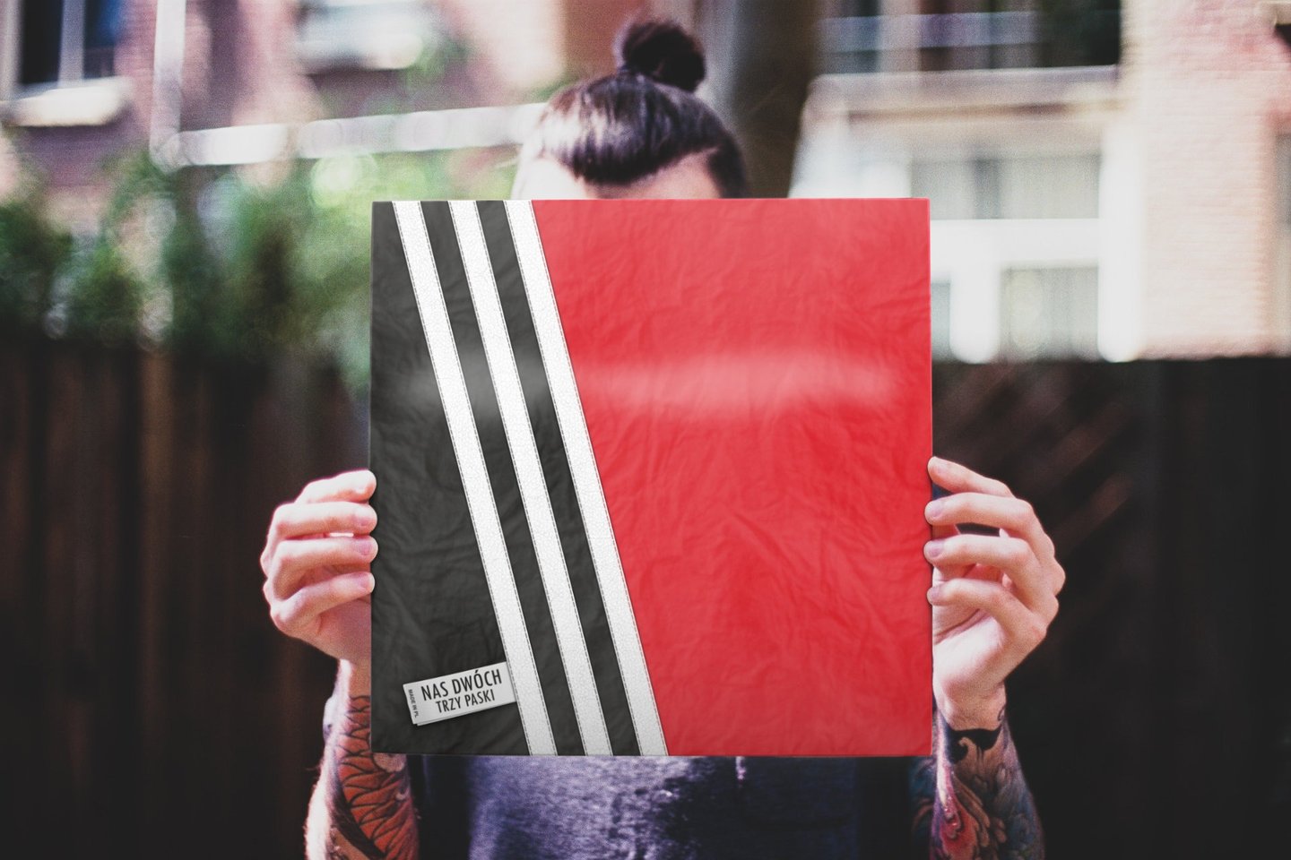 Man holding vinyl album sleeve
