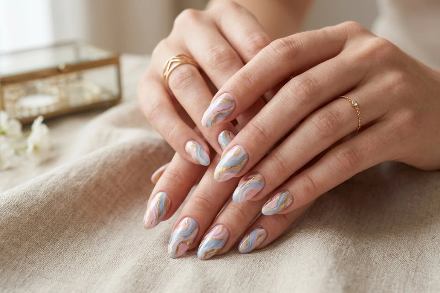 Elegant marble multicolor nail design with glossy swirl effect and luxury style