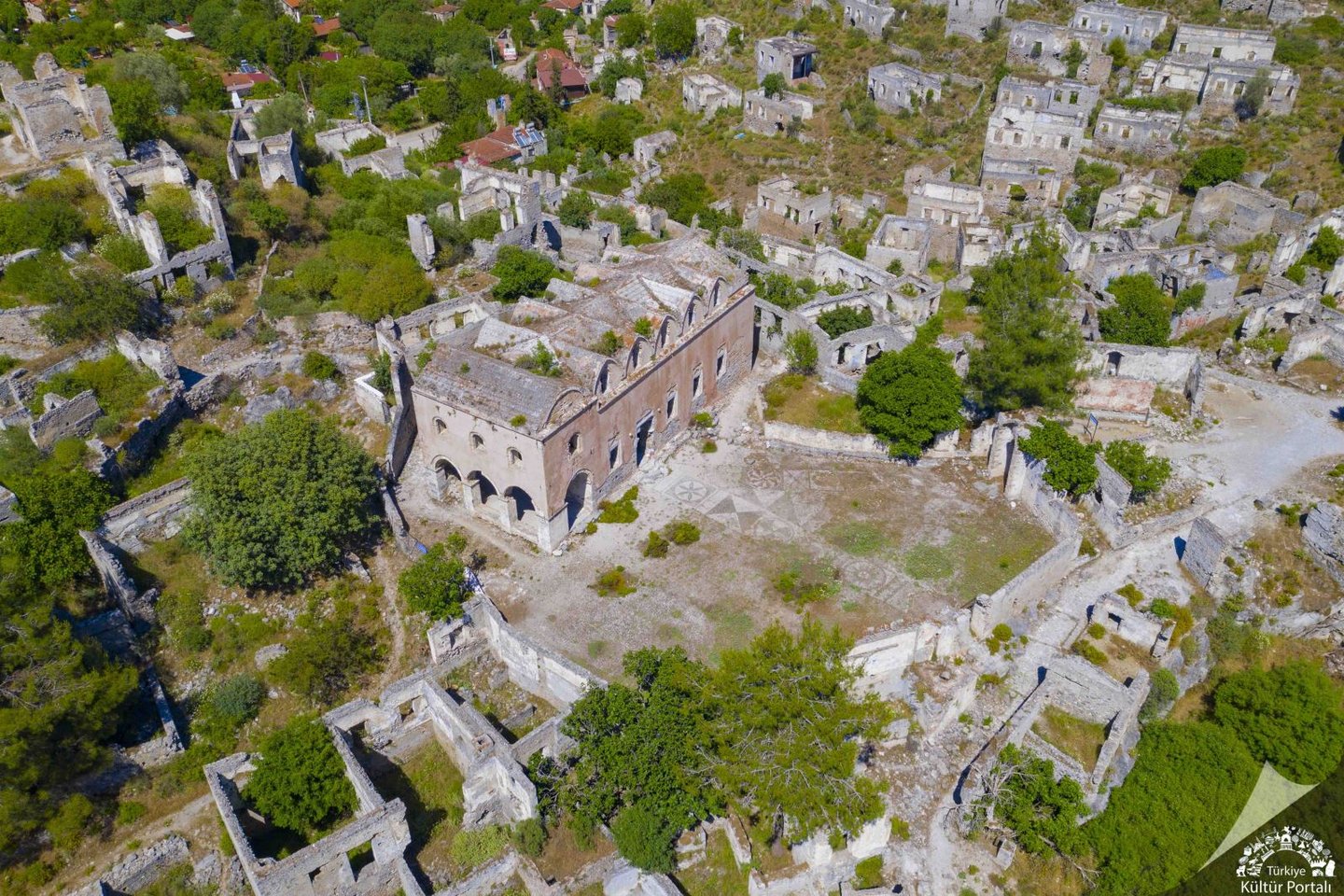 Aerial view of the historic stone ruins and abandoned Greek houses in Kayakoy ghost village, Turkey.