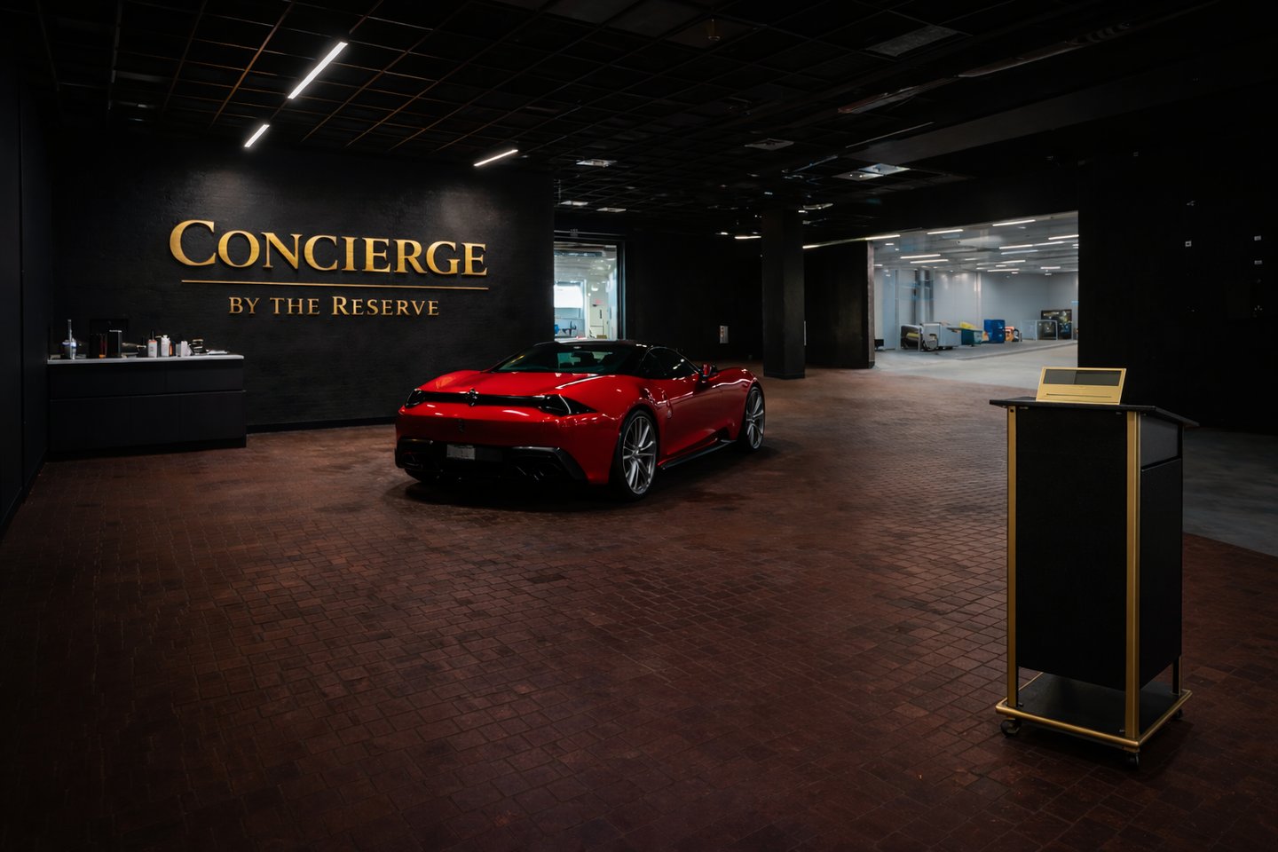 Red Ferrari parked inside the luxury Concierge by the Reserve high-end vehicle storage facility.