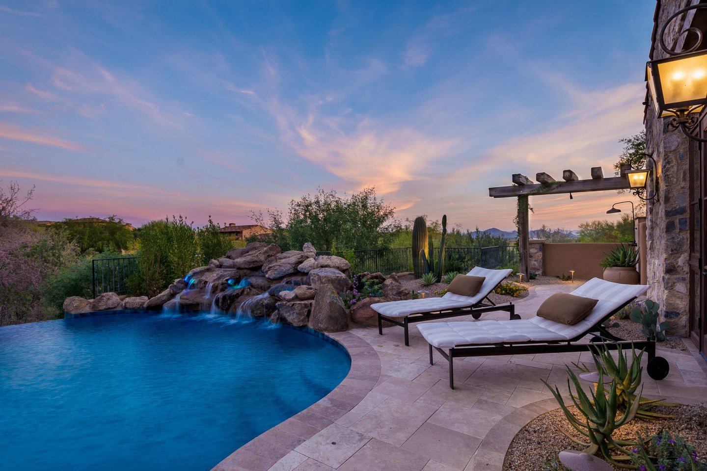 a pool with a waterfall and a waterfall