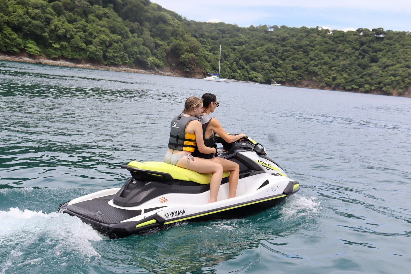 Couple riding jet ski during private tour in Papagayo Gulf, Costa Rica