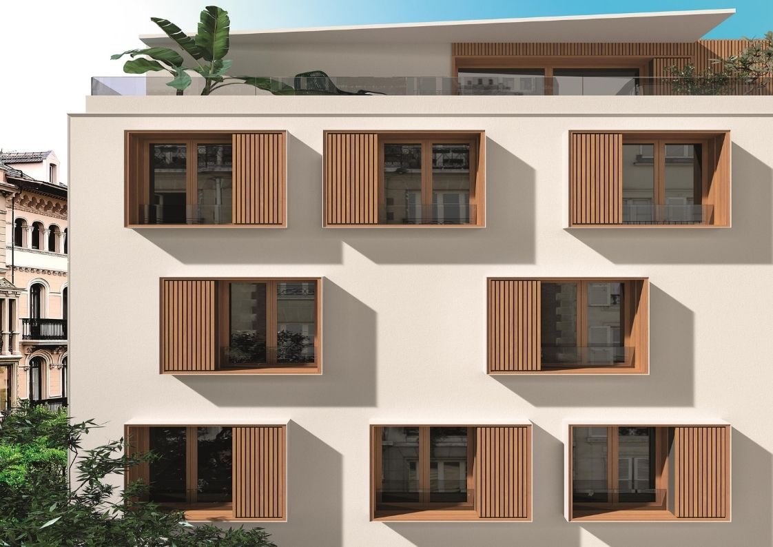 Edificio de apartamentos con volúmenes geométricos y cerramientos exteriores de líneas limpias
