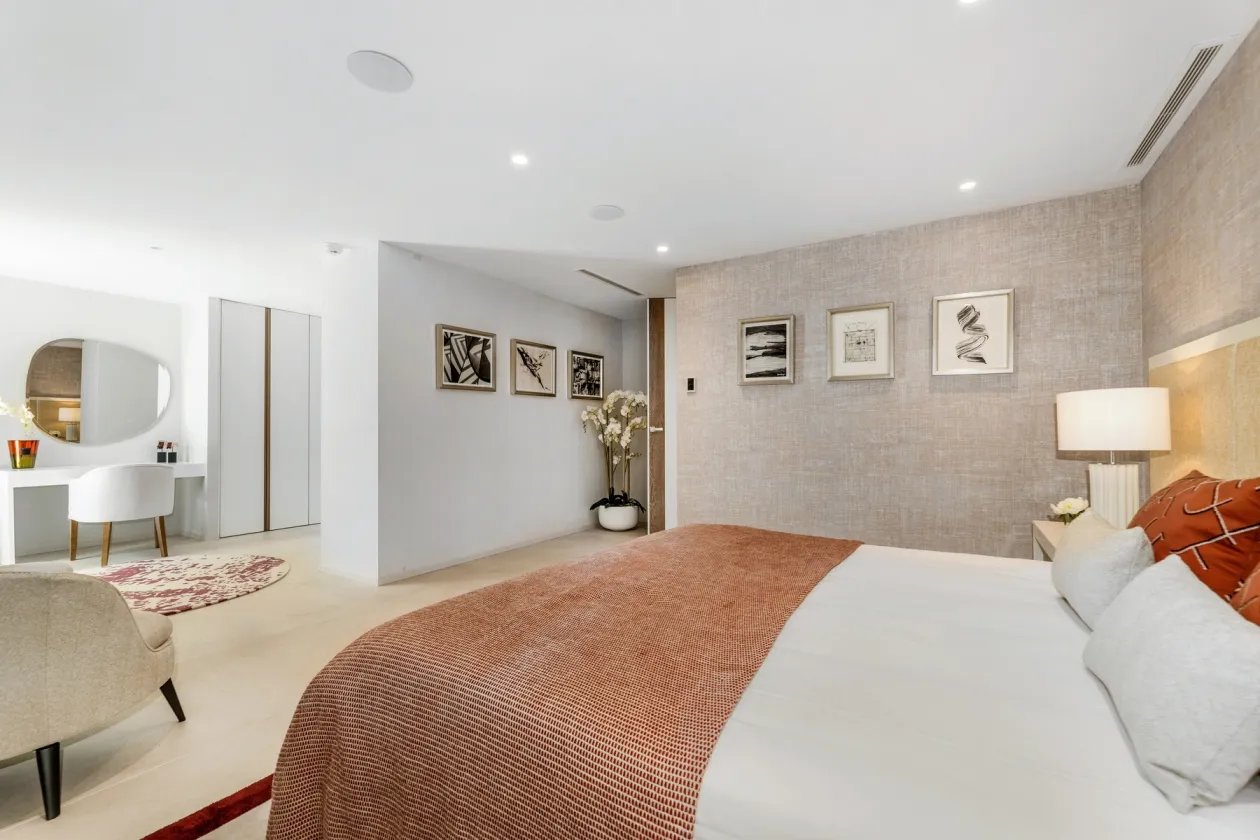Bedroom with warm tones and garden view at Villa Serenity