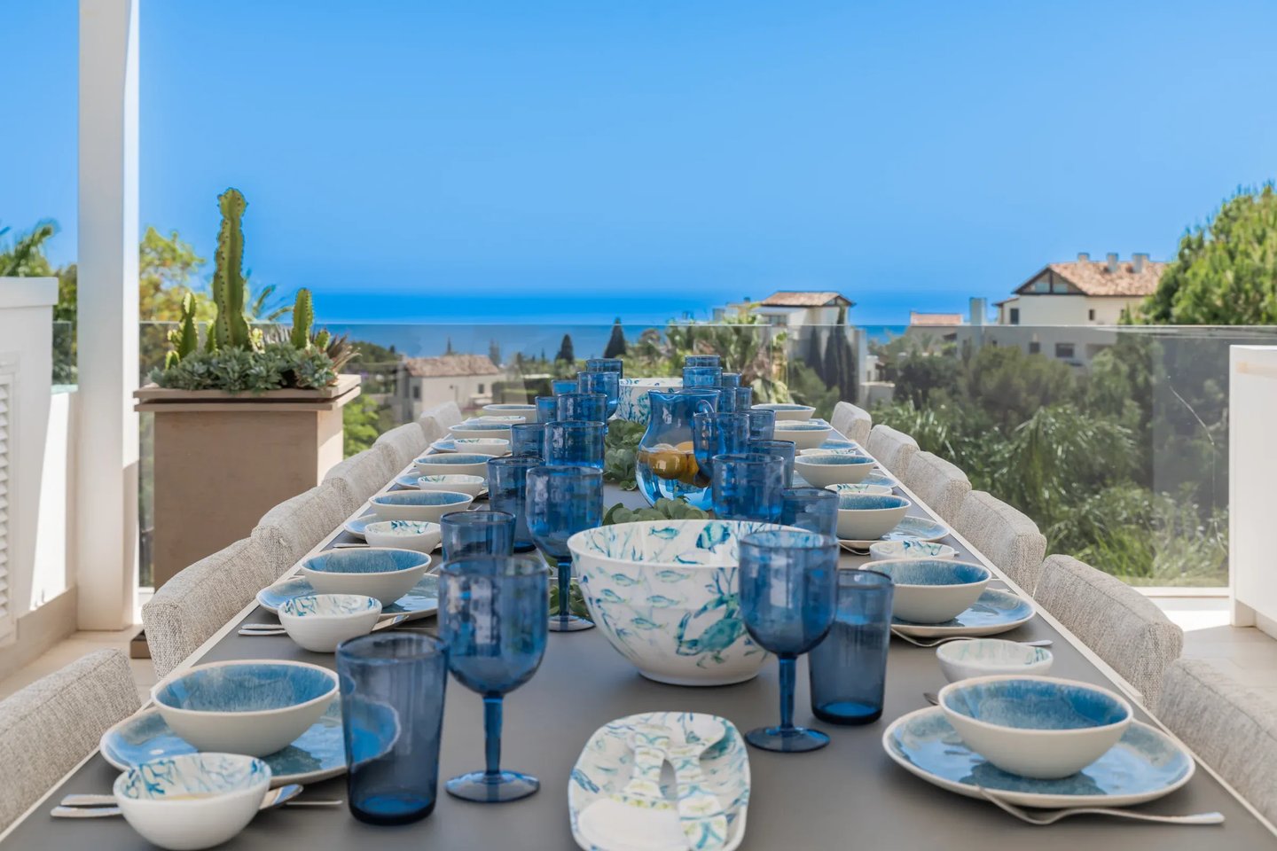 Rooftop dining terrace with ocean backdrop at Villa Serenity