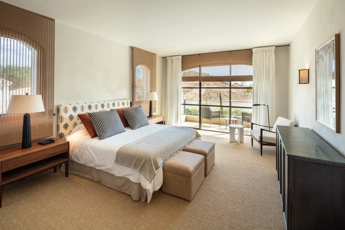 Bedroom at Villa La Gratitud with terrace access and warm tones
