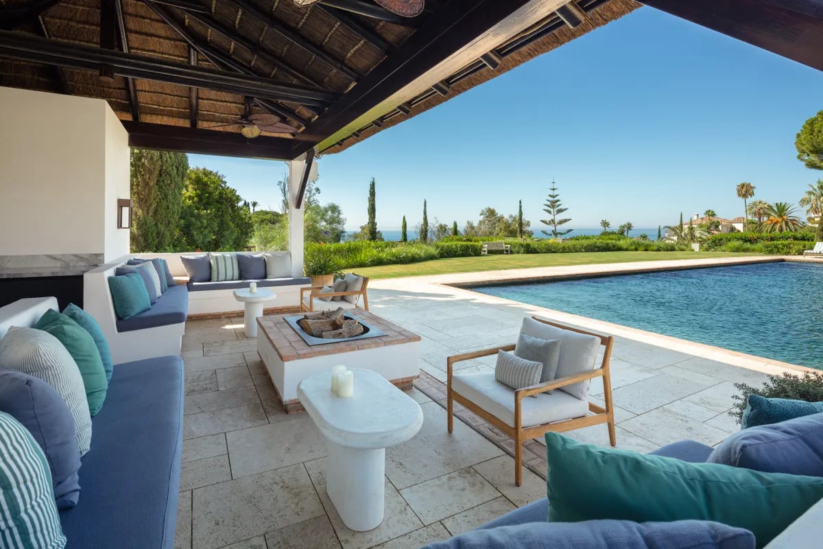 Terrace lounge at Villa La Gratitud with sea views and shaded seating