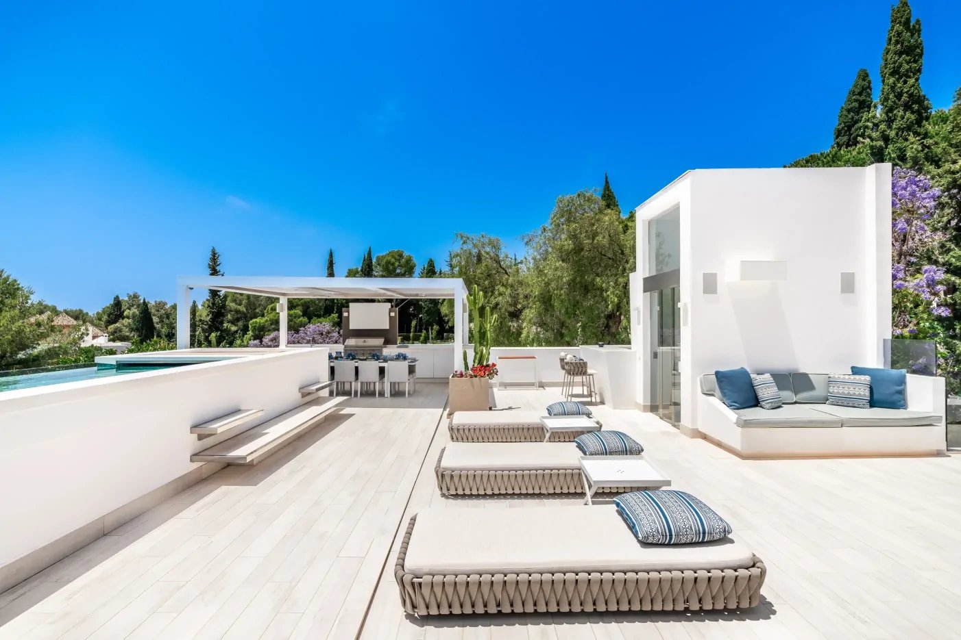 Villa Serenity rooftop with loungers and sweeping sea views