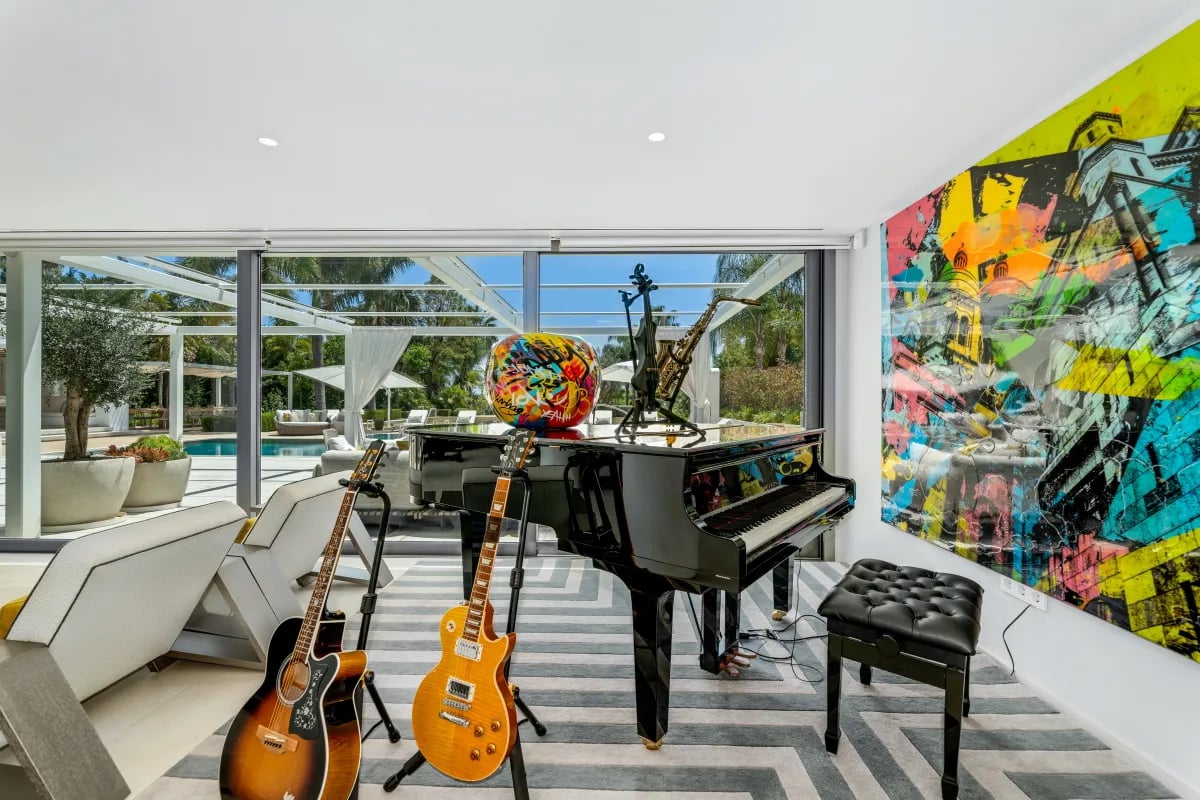Music room at Villa Serenity with piano and guitars