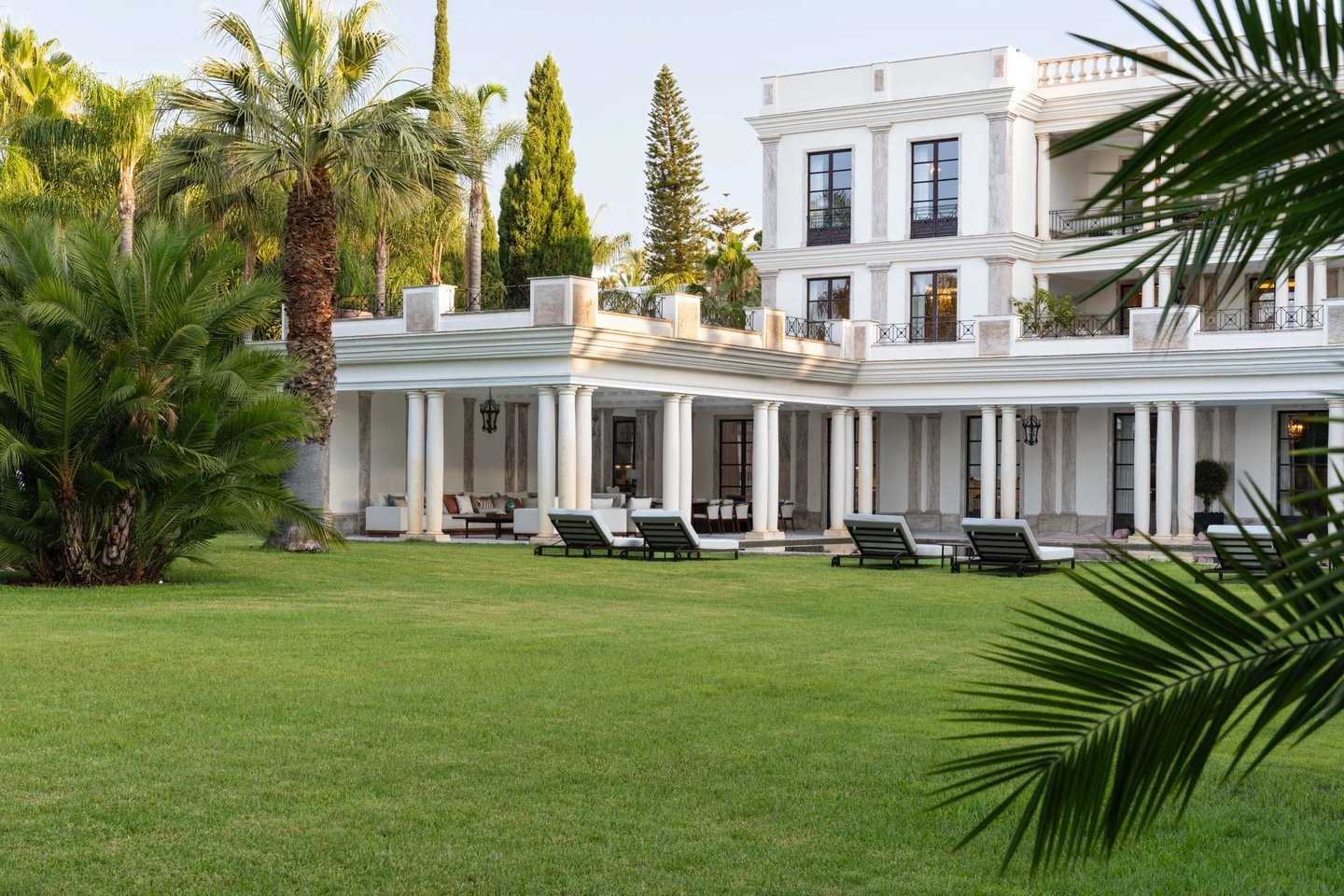 Villa exterior surrounded by lush gardens