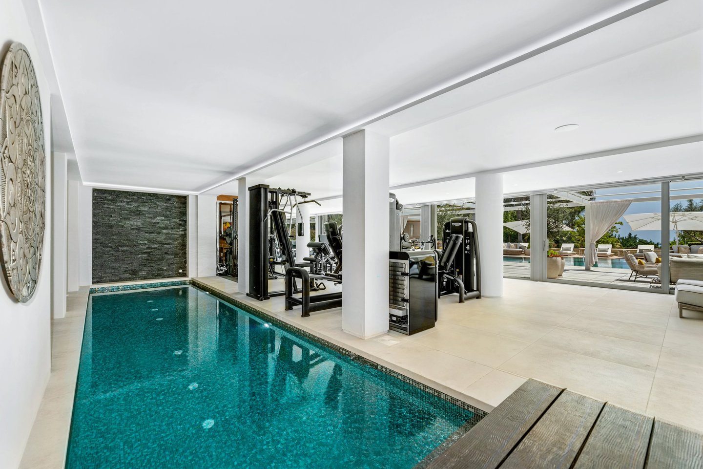 Indoor swimming pool located next to the home gym