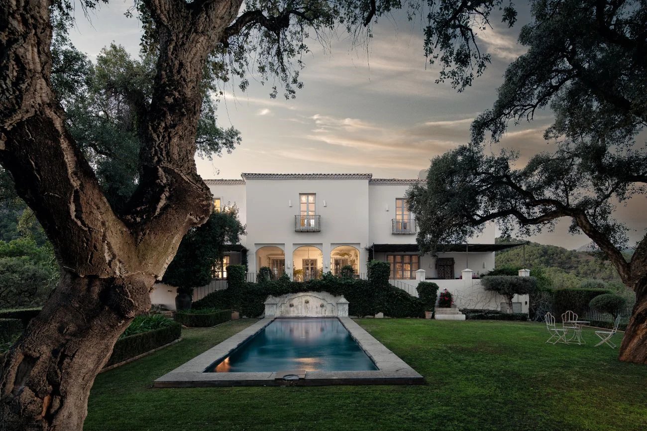 Symmetrical garden with pool at sunset