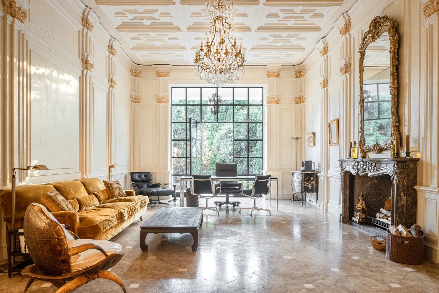 Elegant home office with coffered ceiling, chandelier and marble fireplace