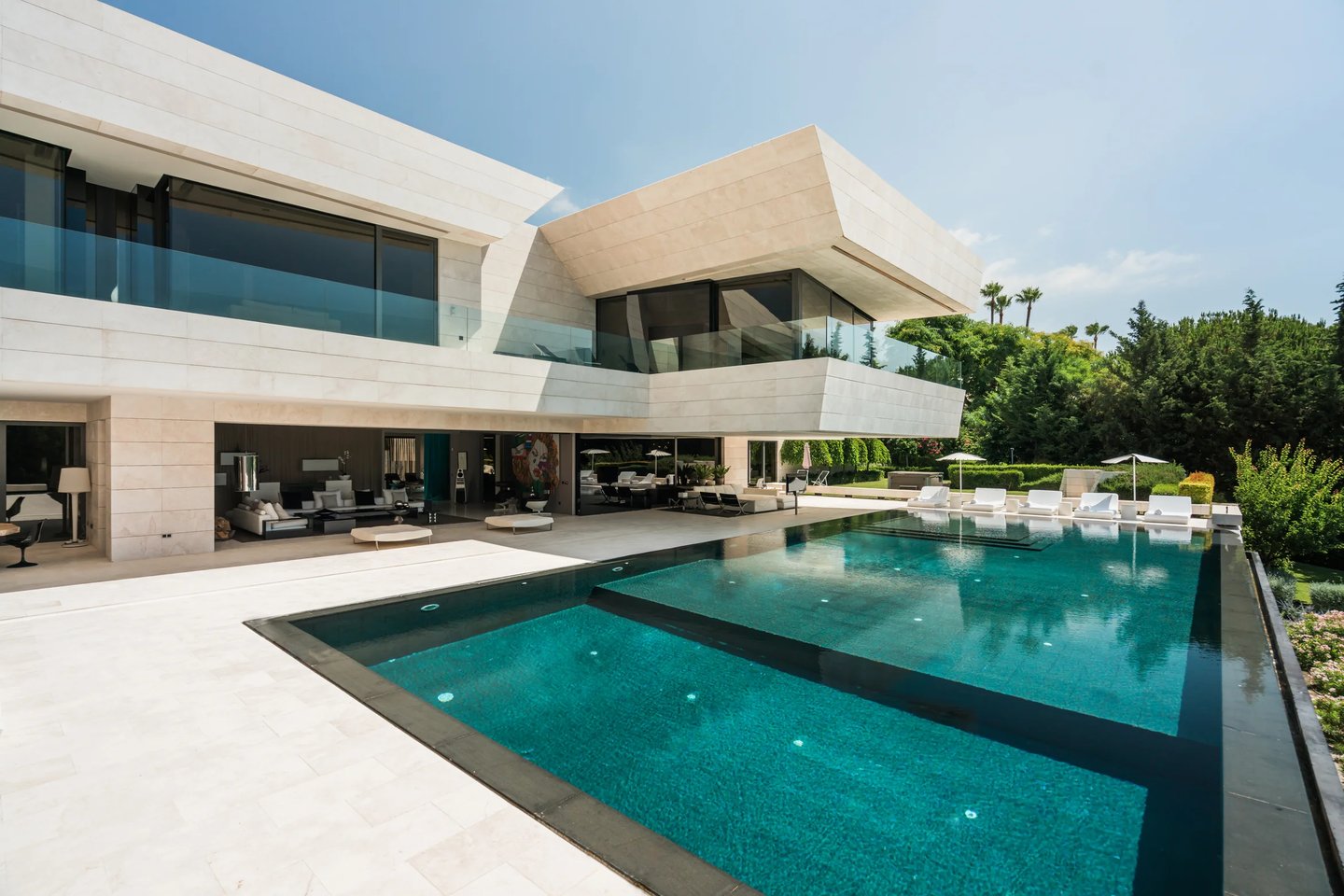 Modern villa exterior with large infinity pool