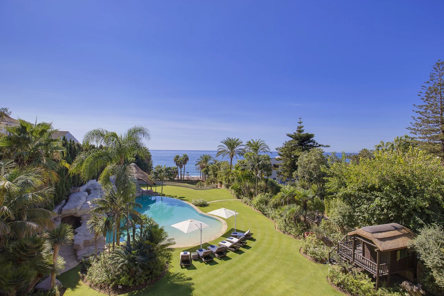 Mediterranean gardens with direct beach access and sea views