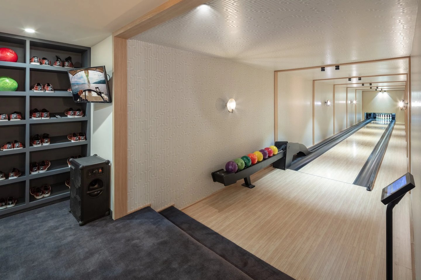 Private bowling alley at Villa La Gratitud with polished lanes and full equipment setup