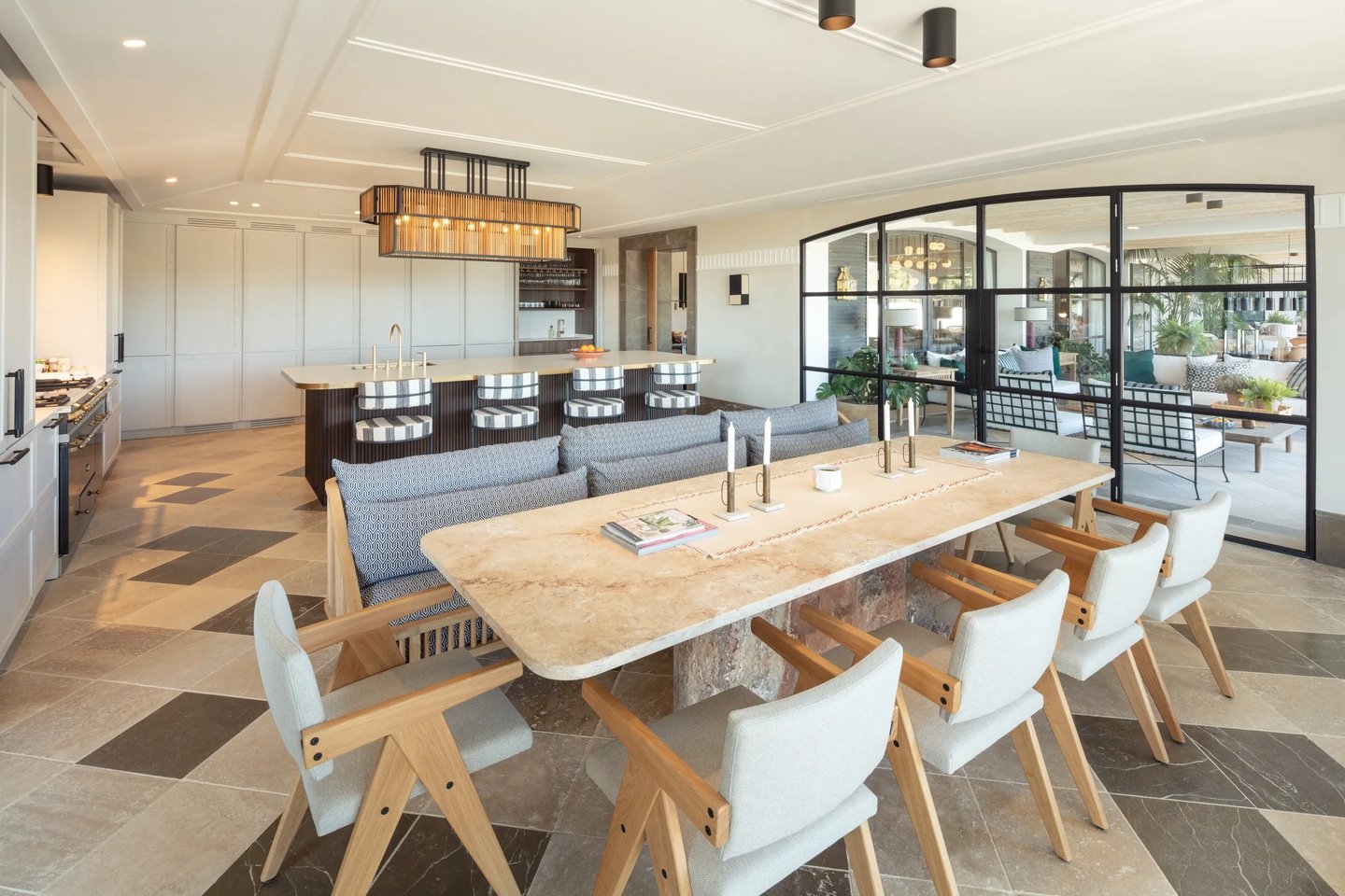 Kitchen at Villa La Gratitud with oak dining table and floor-to-ceiling glass
