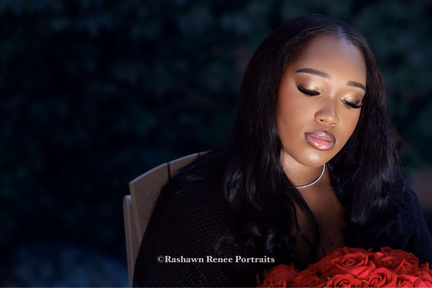 a woman with a bouquet of roses in her hand Senior Portraits