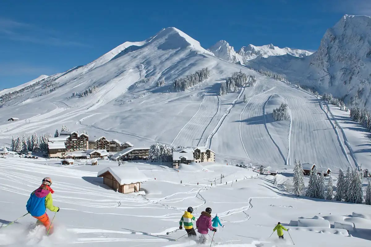 Geneva skiing, with mountains, lodges and skiers
