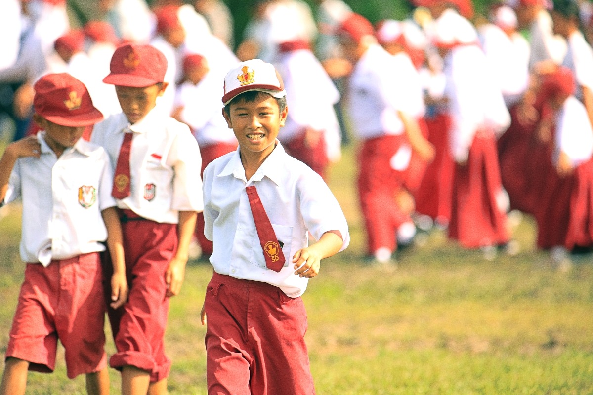 a group of young children in uniform uniforms