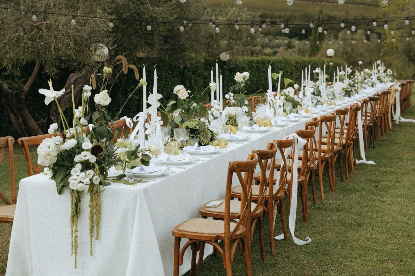 a long table with a long table set for a wedding in Tuscany