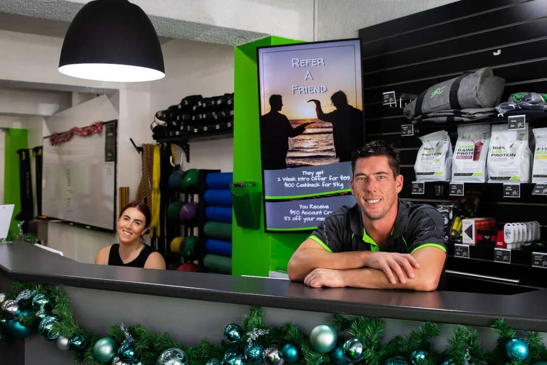 a man and woman in a gym room