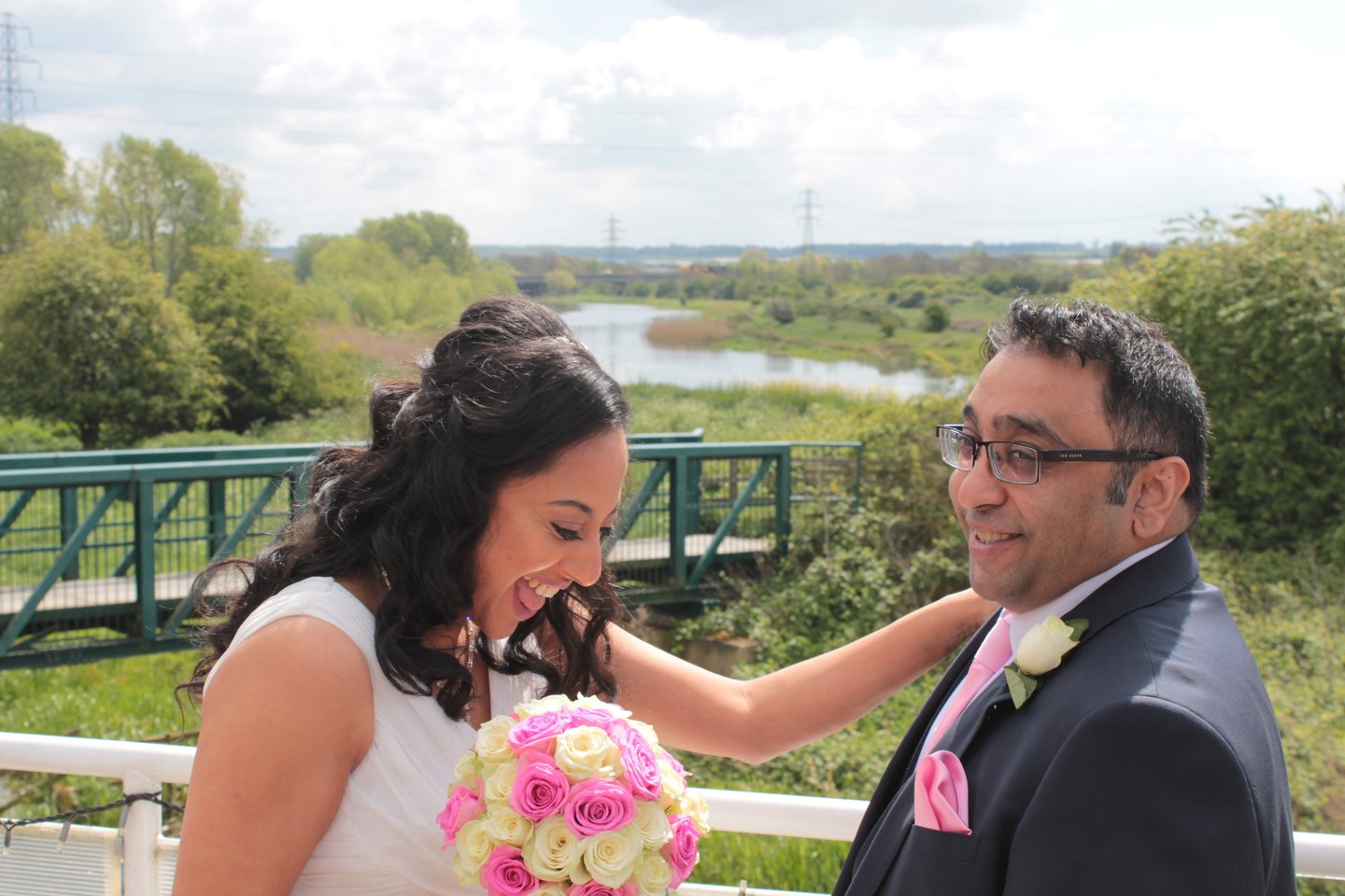 a bride and groom on the top deck of the ark northampton, with midsummer meadow nature reserve