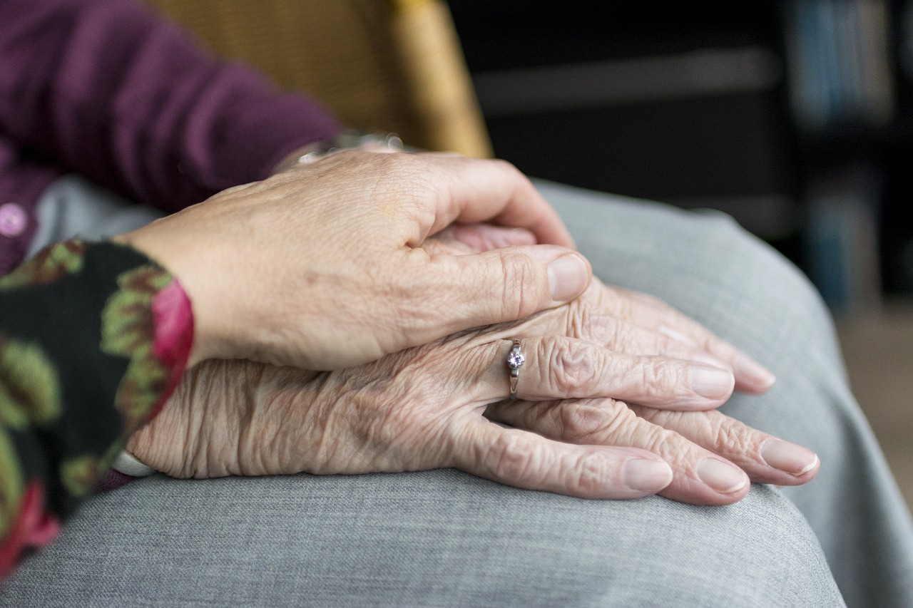 a woman holding a ring on her finger