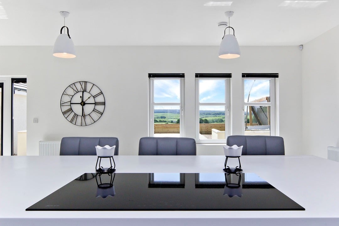 Modern kitchen design with integrated appliances  and a spacious island.